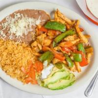Chicken Fajitas Dinner  · served with rice and beans.