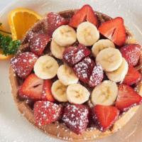 Belgian Waffles with Fruit · Served with strawberries and bananas on top.