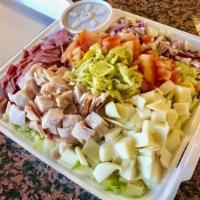 Chopped Italian Salad · Chopped hard salami, turkey breast, provolone cheese, tomato, red onions, pepperoncini, garb...