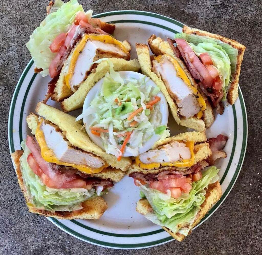 Chicken Club · Grilled chicken breast, Bacon, avocado, tomato, Swiss cheese and mayonnaise on toasted whole wheat. Served with choice of side.