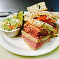 Corned Beef and Pastrami Decker · Swiss cheese, Thousand Island and tomatoes. Served with choice of side.