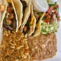 Soft Tacos · 3 tacos with grilled chicken or freshly ground Angus beef, and cheddar cheese in corn tortil...