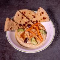 Hummus · Puree of chickpeas blended with yogurt tahini and virgin olive oil. Gluten free.
