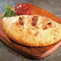 Supreme Calzone · It comes with pepperoni, cheese, onions, black olives, tomatoes, green peppers, and mushrooms.
