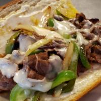 Philly Cheese Steak Sandwich · Philly mix of steak, sauteed bell pepper and onions on a steak roll with mayonnaise, topped ...