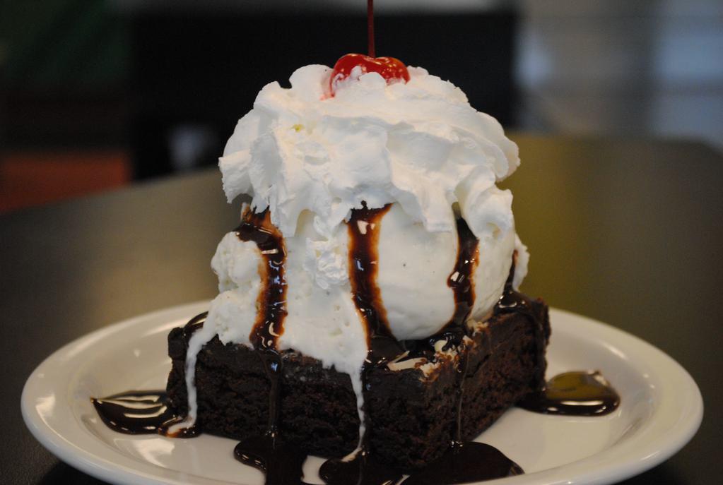 Brownie Sundae · Housemade brownie, vanilla ice cream, Hershey's chocolate, whipped cream and a cherry.