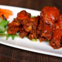 Buffalo Wings · Jumbo Crispy chicken wings tossed in house-made Buffalo sauce.