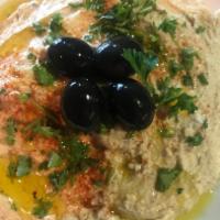 Hummus · Garbanzo  beans blended eith Tahini, olive oil and Lemon juice.