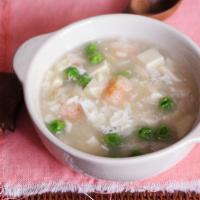 21. Quart of Seafood Soup · With crunchy noodle.