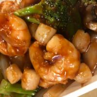 H12. Scallops and Shrimp in Garlic Sauce · Fresh scallops, jumbo shrimp and mixed vegetables in garlic sauce. With white rice. Spicy.