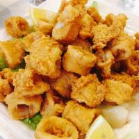 Fried Calamari · Golden fried calamari served with a side of homemade marinara sauce.