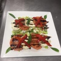Mozzarella Di Casa · Homemade mozzarella, roasted red peppers, tomatoes and basil, virgin olive oil and balsamic ...