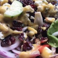 Tricolor Gorgonzola Salad · Mesclun greens, roasted peppers, red onions, cranberries and walnuts.