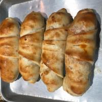 Sausage Roll · Pizza dough rolled with sausage, bell peppers, onions and mozzarella cheese.