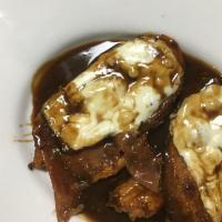 Veal Sorrentino · Layered veal with breaded eggplant, smoked prosciutto and melted mozzarella simmered in a ma...