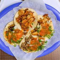 Tacos · Regular soft taco with meat, cilantro, onions, and salsa