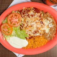 3 Enchilada Plate · Three enchiladas choice of meat, rice, beans, sour cream, guacamole, lettuce and tomatoes