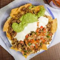 Super Nachos · Served with choice of meat, guacamole, cheese, sour cream, and salsa