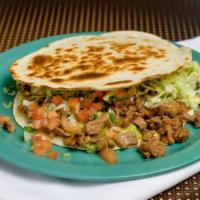 Super Quesadilla · Served with choice of meat, guacamole, cheese, sour cream, lettuce and salsa