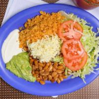 Vegetarian Plate · Served with rice, beans, cheese, sour cream, lettuce, guacamole, tomatoes, and tortillas