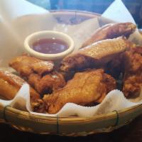 Chicken Wings · 6 pieces. Deep fried chicken wings.