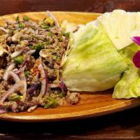 Larb Beef  · Ground beef cilantro, onion, green onion, lettuce and lime leaves.
(come with rice)