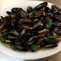 Basil Mussels · Stir-fried mussels with chili paste, onions, green onions and basil.(come with rice)