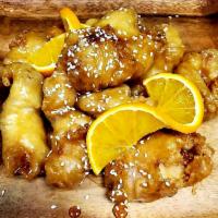 Orange Chicken  · Crispy chicken with orange sauce and sesame seeds on top.(served with rice)
