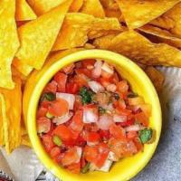 Chips & Salsa · A basket of homemade chips and our pico de Gallo. 