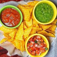 Chips & Salsa Sampler · House Made Tortilla Chips Served with Roasted Tomato Salsa, Salsa Verde and Pico de Gallo.