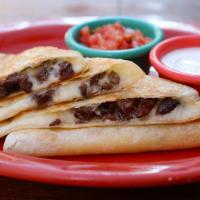 Quesadilla De Carne · Steak. Chihuahua cheese, queso fresco and Monterrey jack cheese melted between a grilled flo...
