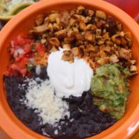 Burrito Bowl · Mexican rice, refried black beans, your choice of protein or veggie, and topped with crema f...