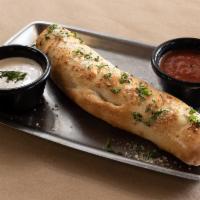 Pepperoni Roll · Pizza dough wrapped around pepperoni and mozzarella, baked until golden, served with marinar...
