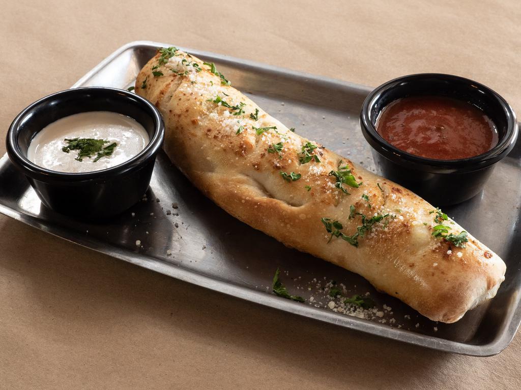 Pepperoni Roll · Pizza dough wrapped around pepperoni and mozzarella, baked until golden, served with marinara and ranch dressing. Add green chili for an additional charge.