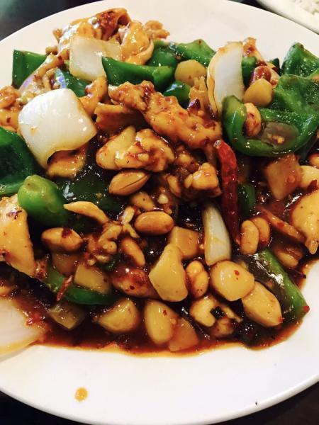 Kung Pao Chicken · Stir fried with peanuts, bell peppers, onions and water chestnuts in spicy brown sauce.