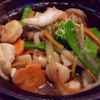 House Special Seafood · Shrimps, scallops, squid, black mushrooms, snow peas, carrots and broccoli sauteed in a spic...