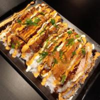 Chicken Katsu · Breaded chicken cutlet served over a bed of steamed rice. Drizzled with katsu sauce and spic...