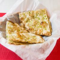 Garlic Naan · Oven-baked flatbread topped with garlic. 