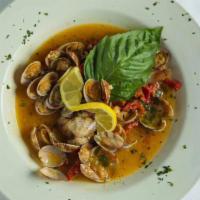 Clams Casino · Baby clams sauteed with sun-dried tomatoes in a roasted garlic and white wine lemon butter s...