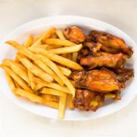 Wings and Fries · Fried seasoned chicken wings with french fries.