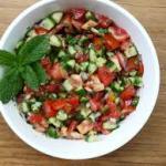 Traditional Salad · (Salata na’meh); fine chopped cucumbers and tomatoes, parsley, mint, mixed with tahini dress...