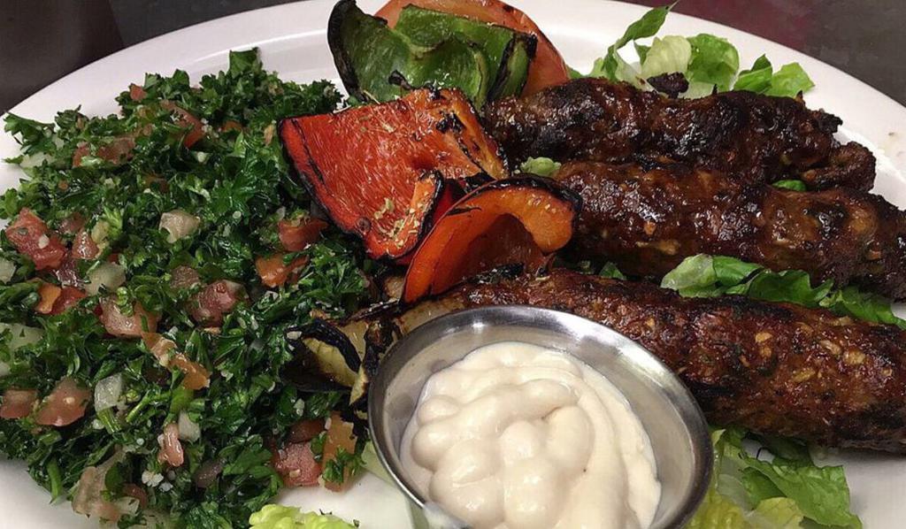 Beef Kafta Kebob Platter · Mixed ground beef marinated with onions, parsley, and seasonings, topped with tahini sauce.