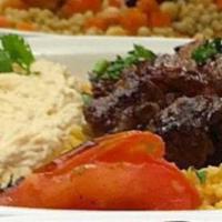 Shish Kebob Platter · Lamb cubes marinated and grilled to perfection with our special seasonings, topped with tahi...
