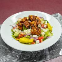 Greek Salad Topped with Chicken Kabob · Our traditional greek salad with feta cheese topped with grilled chicken kabob.