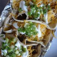 Taco Plate · Three brisket or pork tacos cheese and sour cream.