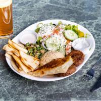 Vegetarian Combination Plate · Portions of hummus, tabbouleh, falafel and spanakopita. Served with tahini and tzatziki sauc...