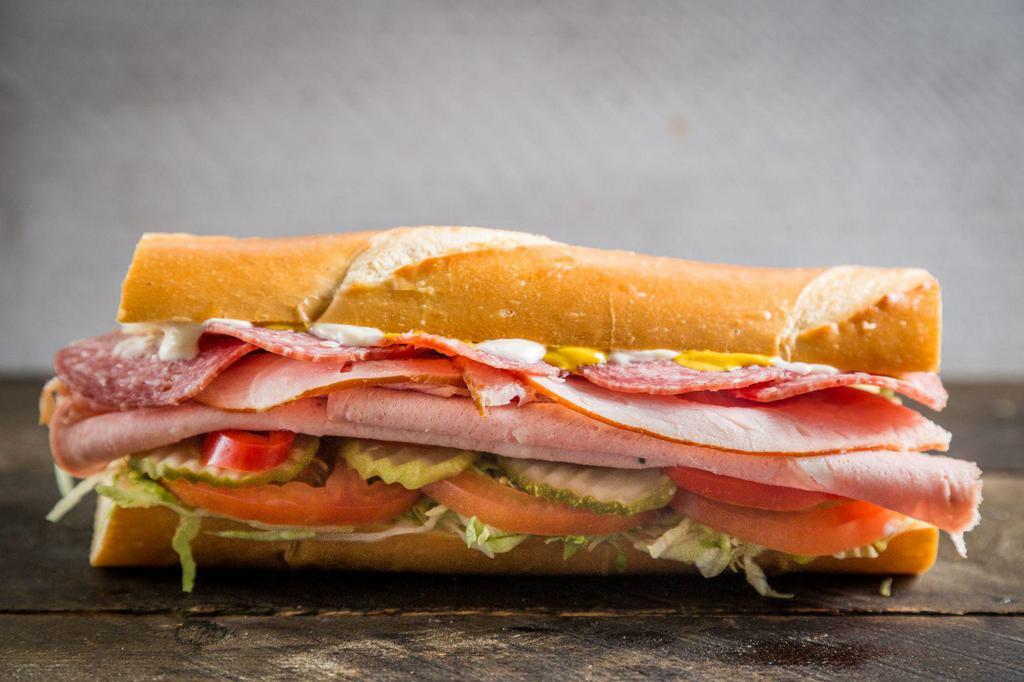 Sinatra Signature Sandwicheez · Ham, salami, Italian mortadella, provolone cheese and the works: Lettuce, tomatoes, pickles, pepperoncini, real mayo, mustard, extra virgin olive oil, balsamic vinegar, salt and pepper.