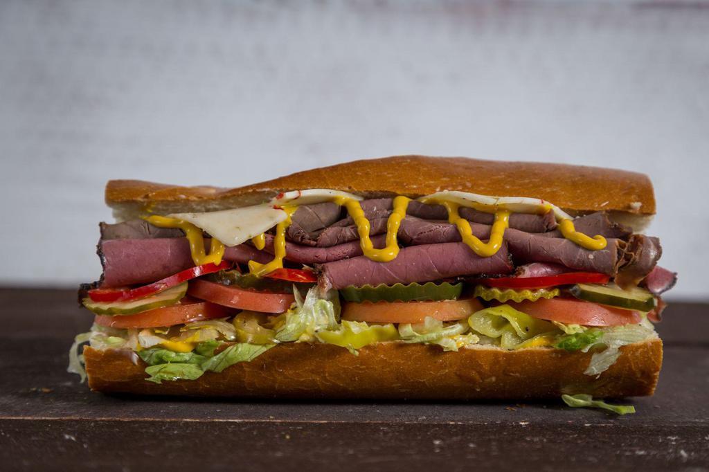 Roadhouse Beef Signature Sandwicheez · Hot or cold. Pastrami, roast beef and pepper jack cheese, topped with the works: Lettuce, tomatoes, pickles, pepperoncini, real mayo, mustard, extra virgin olive oil, balsamic vinegar, salt and pepper.