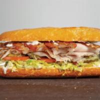 Turkey Bacon Club Sandwicheez · Turkey, ham, bacon, Swiss cheese and the works: lettuce, tomatoes, pickles, pepperoncini, re...