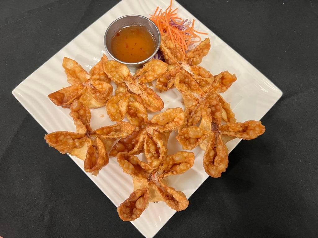 Crab Delight · Wonton stuffed with snow crab, cream cheese and sweet chili.